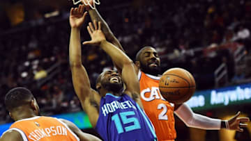 Dec 10, 2016; Cleveland, OH, USA; Charlotte Hornets guard Kemba Walker (15) loses the ball as Cleveland Cavaliers guard Kyrie Irving (2) defends during the first quarter at Quicken Loans Arena. Mandatory Credit: Ken Blaze-USA TODAY Sports