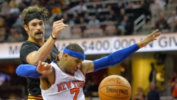 Nov 4, 2015; Cleveland, OH, USA; New York Knicks forward Carmelo Anthony (7) and Cleveland Cavaliers forward Kevin Love (0) battle for a rebound during a game at Quicken Loans Arena. Cleveland won 96-86. Mandatory Credit: David Richard-USA TODAY Sports