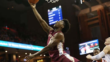 Dec 31, 2016; Charlottesville, VA, USA; Florida State Seminoles guard Dwayne Bacon (4) shoots the ball as Virginia Cavaliers guard Kyle Guy (5) looks on in the first half at John Paul Jones Arena. Mandatory Credit: Geoff Burke-USA TODAY Sports