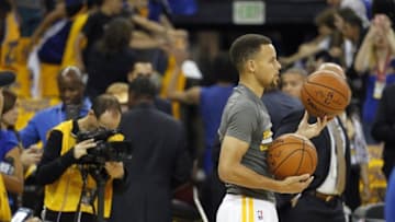 Apr 18, 2016; Oakland, CA, USA; Golden State Warriors guard Stephen Curry (30) stands on the court during warm ups before the start of the game against the Houston Rockets in game two of the first round of the NBA Playoffs at Oracle Arena. Mandatory Credit: Cary Edmondson-USA TODAY Sports