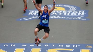 BOSTON, MA - APRIL 17: Michael Baumann jumps in the air as he crosses the finish line of the 121st Boston Marathon in Boston on Apr. 17, 2017. (Photo by Jessica Rinaldi/The Boston Globe via Getty Images)