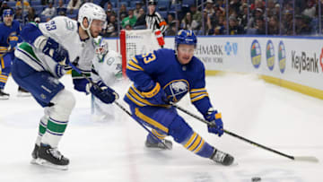 BUFFALO, NEW YORK - NOVEMBER 15: Jeff Skinner #53 of the Buffalo Sabres skates against Oliver Ekman-Larsson #23 of the Vancouver Canucks during the second period of an NHL hockey game at KeyBank Center on November 15, 2022 in Buffalo, New York. (Photo by Joshua Bessex/Getty Images)