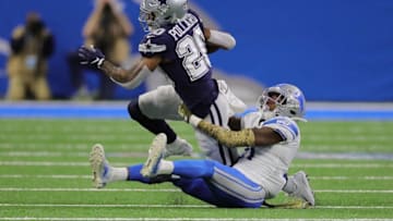 DETROIT, MI - NOVEMBER 17: Tony Pollard #20 of the Dallas Cowboys runs for a short gain as Tracy Walker #21 of the Detroit Lions gives chase during the second quarter of the game at Ford Field on November 17, 2019 in Detroit, Michigan. (Photo by Leon Halip/Getty Images)