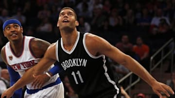 Oct 8, 2016; New York, NY, USA; Brooklyn Nets center Brook Lopez (11) defends New York Knicks forward Carmelo Anthony (7) during the first half at Madison Square Garden. Mandatory Credit: Adam Hunger-USA TODAY Sports