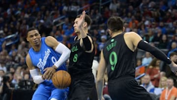 Dec 25, 2016; Oklahoma City, OK, USA; Oklahoma City Thunder guard Russell Westbrook (0) is fouled by Minnesota Timberwolves guard Zach LaVine (8) during the fourth quarter at Chesapeake Energy Arena. Mandatory Credit: Mark D. Smith-USA TODAY Sports