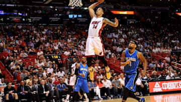 Apr 10, 2016; Miami, FL, USA; Miami Heat forward Gerald Green (14) dunks the ball as Orlando Magic forward Devyn Marble (11) looks on during the second half at American Airlines Arena. The Heat won 118-96. Mandatory Credit: Steve Mitchell-USA TODAY Sports