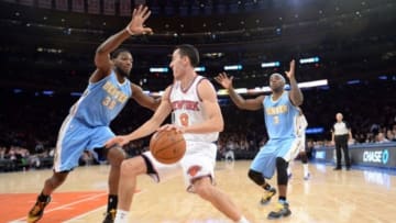 Feb 7, 2014; New York, NY, USA; Denver Nuggets power forward Kenneth Faried (35) and Denver Nuggets point guard Ty Lawson (3) guard New York Knicks point guard Pablo Prigioni (9) during the second half at Madison Square Garden. The New York Knicks won the game 117-90. Mandatory Credit: Joe Camporeale-USA TODAY Sports