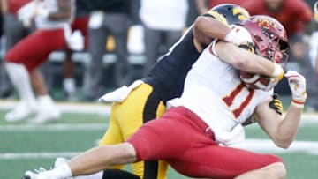 IOWA CITY, IOWA- SEPTEMBER 08: Tight end Chase Allen #11 of the Iowa State Cyclones is brought down during the second half by defensive back Amani Hooker #27 of the Iowa Hawkeyes on September 8, 2018 at Kinnick Stadium, in Iowa City, Iowa. (Photo by Matthew Holst/Getty Images)