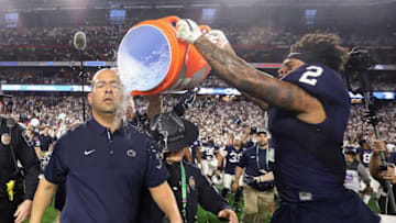 GLENDALE, AZ - DECEMBER 30: Head coach James Franklin of the Penn State Nittany Lions is dunked with gatorade by safety Marcus Allen #2 after defeating the Washington Huskies in the Playstation Fiesta Bowl at University of Phoenix Stadium on December 30, 2017 in Glendale, Arizona. The Nittany Lions defeated the Huskies 35-28. (Photo by Christian Petersen/Getty Images)