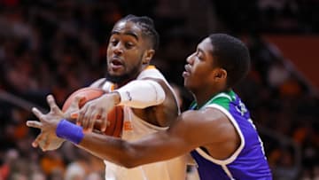 KNOXVILLE, TN - DECEMBER 2: Jordan Bone #0 of the Tennessee Volunteers drives past Myles Smith #2 of the Texas A&M-CC Islanders during the first half of their game at Thompson-Boling Arena on December 2, 2018 in Knoxville, Tennessee. (Photo by Donald Page/Getty Images)