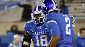 Nov 21, 2015; Lexington, KY, USA; Kentucky Wildcats running back Stanley Boom Williams (18) celebrates with wide receiver Dorian Baker (2) during the game against the Charlotte 49ers in the second half at Commonwealth Stadium. Mandatory Credit: Mark Zerof-USA TODAY Sports