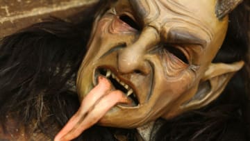 SALZBURG, AUSTRIA - DECEMBER 15: A Krampus mask lies on the floor in the workshop belonging to sculptor and woodworker Rupert Kreuzer on December 15, 2017 in Grossarl, near Salzburg, Austria. Krampus is a demonic, horned creature who in folklore punishes naughty children in the German-speaking Alpine region of Germany and Austria during the Christmas season. The 'Krampus Runs', which sees locals, usually young men, dressed as the beast terrorize residents in city centers during the Christmas season has recently seen a resurgence of the 500-year-old tradition. The revival has meant that some woodworkers in the region are carving creations beyond the mere decorative, as many of the performers insist on traditional materials such as wood, while shunning plastic, for their frightful costumes. (Photo by Adam Berry/Getty Images)