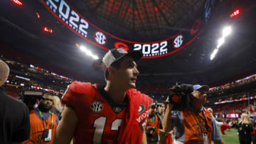 ATLANTA, GEORGIA - DECEMBER 03: Stetson Bennett #13 of the Georgia Bulldogs celebrates after defeating the LSU Tigers in the SEC Championship game at Mercedes-Benz Stadium on December 03, 2022 in Atlanta, Georgia. (Photo by Todd Kirkland/Getty Images)