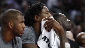 Nov 25, 2016; Auburn Hills, MI, USA; Los Angeles Clippers center DeAndre Jordan (6) and guard Chris Paul (left) look on from the bench during the fourth quarter against the Detroit Pistons at The Palace of Auburn Hills. Pistons win 108-97. Mandatory Credit: Raj Mehta-USA TODAY Sports