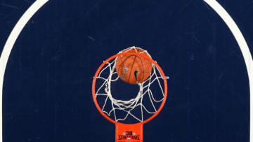 MEMPHIS, TN - MARCH 14: A general view of a basketball going through a net during a game against the Connecticut Huskies and the Cincinnati Bearcats during the semifinals of the American Athletic Conference Tournament at FedExForum on March 14, 2014 in Memphis, Tennessee. Connecticut defeated Cincinnati 58-56. (Photo by Joe Murphy/Getty Images)