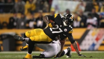 Nov 2, 2014; Pittsburgh, PA, USA; Pittsburgh Steelers running back LeGarrette Blount (27) is tackled by Baltimore Ravens linebacker C.J. Mosley (57) during the first half of the game at Heinz Field. Mandatory Credit: Jason Bridge-USA TODAY Sports