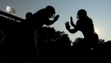 Aug 3, 2014; Canton, OH, USA; New York Giants offensive lineman warm up prior to the 2014 Pro Football Hall of Fame game against the Buffalo Bills at Fawcett Stadium. Mandatory Credit: Andrew Weber-USA TODAY Sports
