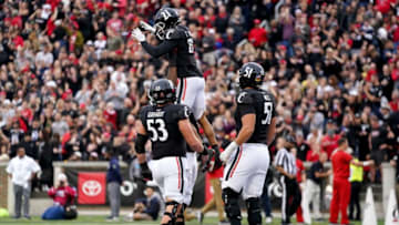 Cincinnati Bearcats wide receiver Tyler Scott celebrates a touchdown against Navy Midshipmen at Nippert Stadium. The Enquirer.