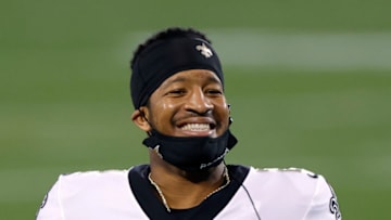 CHARLOTTE, NORTH CAROLINA - JANUARY 03: Quarterback Jameis Winston #2 of the New Orleans Saints shares a smile during the second half of their game against the Carolina Panthers at Bank of America Stadium on January 03, 2021 in Charlotte, North Carolina. (Photo by Jared C. Tilton/Getty Images)