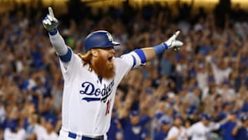 LOS ANGELES, CA - OCTOBER 15: Justin Turner #10 of the Los Angeles Dodgers celebrates after hitting the winning home run in the bottom of the ninth inning making the score 4-1 during Game Two of the National League Championship Series against the Chicago Cubs at Dodger Stadium on October 15, 2017 in Los Angeles, California. (Photo by Ezra Shaw/Getty Images)