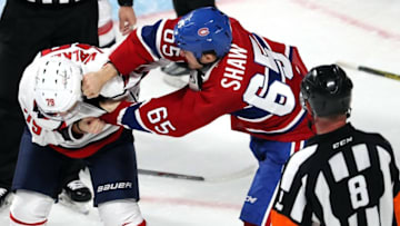 Sep 27, 2016; Montreal, Quebec, CAN; Montreal Canadiens center Andrew Shaw (65) and Washington Capitals left wing Nathan Walker (79) fight during the second period of a preseason hockey game at Bell Centre. Mandatory Credit: Jean-Yves Ahern-USA TODAY Sports