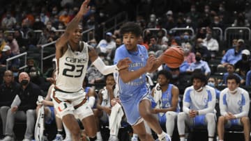 CORAL GABLES, FL - JANUARY 18: Puff Johnson #14 of the North Carolina Tar Heels drives to the basket during the second half against the Miami (Fl) Hurricanes at Watsco Center on January 18, 2022 in Coral Gables, Florida. (Photo by Eric Espada/Getty Images)
