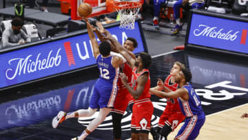Mar 11, 2021; Chicago, Illinois, USA; Philadelphia 76ers forward Tobias Harris (12) shoots the ball against Chicago Bulls center Wendell Carter Jr. (34) and forward Patrick Williams (9) during the first half at United Center. Mandatory Credit: Kamil Krzaczynski-USA TODAY Sports