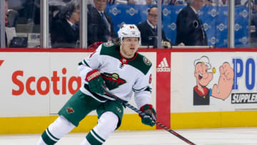 WINNIPEG, MB - APRIL 13: Mikael Granlund #64 of the Minnesota Wild keeps an eye on the play during first period action against the Winnipeg Jets in Game Two of the Western Conference First Round during the 2018 NHL Stanley Cup Playoffs at the Bell MTS Place on April 13, 2018 in Winnipeg, Manitoba, Canada. The Jets defeated the Wild 4-1 to lead the series 2-0. (Photo by Jonathan Kozub/NHLI via Getty Images)