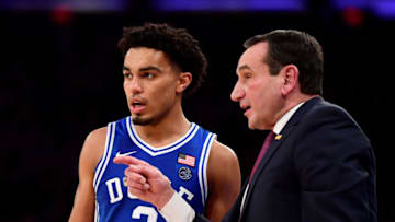 Duke basketball head coach Mike Krzyzewski talks to point guard Tre Jones. (Photo by Emilee Chinn/Getty Images)