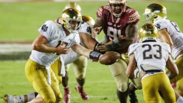 Notre Dame Fighting Irish quarterback Jack Coan (17) hands the ball off to Notre Dame Fighting Irish running back Kyren Williams (23).The Notre Dame Fighting Irish lead the Florida State Seminoles 17-14 at the half Sunday, Sept. 5, 2021.
Fsu V Notre Dame458