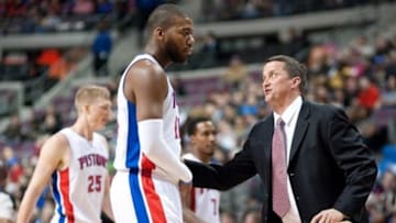 Feb 22, 2014; Auburn Hills, MI, USA; Detroit Pistons head coach John Loyer talks to power forward Greg Monroe (10) during the first quarter against the Dallas Mavericks at The Palace of Auburn Hills. Mandatory Credit: Tim Fuller-USA TODAY Sports