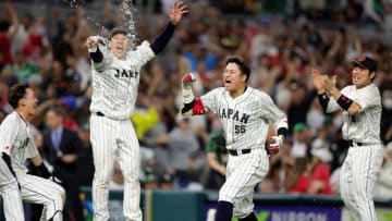 MIAMI, FLORIDA - MARCH 20: Munetaka Murakami #55 of Team Japan celebrates with teammates after hitting a two-run double to defeat Team Mexico 6-5 in the World Baseball Classic Semifinals at loanDepot park on March 20, 2023 in Miami, Florida. (Photo by Megan Briggs/Getty Images)