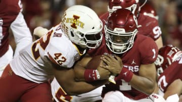 Nov 9, 2019; Norman, OK, USA; Iowa State Cyclones linebacker Marcel Spears Jr. (42) tackles Oklahoma Sooners quarterback Jalen Hurts (1) during the second quarter at Gaylord Family - Oklahoma Memorial Stadium. Mandatory Credit: Kevin Jairaj-USA TODAY Sports
