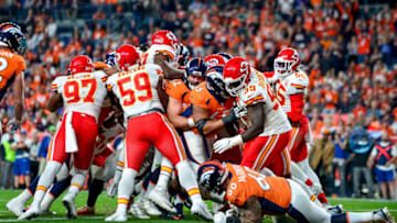 DENVER, CO - OCTOBER 17: The Denver Broncos offense pushes across the goal line for a first quarter Royce Freeman #28 touchdown against the Kansas City Chiefs at Empower Field at Mile High on October 17, 2019 in Denver, Colorado. (Photo by Dustin Bradford/Getty Images)