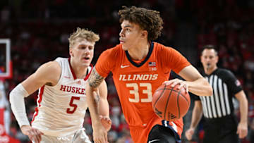 Jan 10, 2023; Lincoln, Nebraska, USA; Illinois Fighting Illini forward Coleman Hawkins (33) drives against Nebraska Cornhuskers guard Sam Griesel (5) in the second half at Pinnacle Bank Arena. Mandatory Credit: Steven Branscombe-USA TODAY Sports