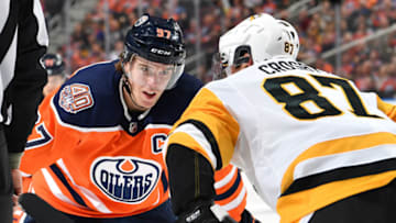 EDMONTON, AB - OCTOBER 23: Connor McDavid #97 of the Edmonton Oilers lines up for a face off against Sidney Crosby #87 of the Pittsburgh Penguins on October 23, 2018 at Rogers Place in Edmonton, Alberta, Canada. (Photo by Andy Devlin/NHLI via Getty Images)