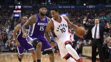 Nov 6, 2016; Toronto, Ontario, CAN; Toronto Raptors guard DeMar DeRozan (10) dribbles the ball past Sacramento Kings center DeMarcus Cousins (15) during the second half at Air Canada Centre. The Kings won 96-91. Mandatory Credit: Tom Szczerbowski-USA TODAY Sports