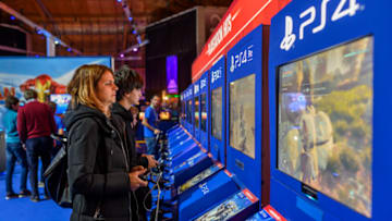 LISBON, PORTUGAL - NOVEMBER 16: Visitors play video games in Moche XL Games World event at Altice Arena on November 16, 2019 in Lisbon, Portugal. Moche XL Games World consists of several experimentation areas: PlayStation, Nintendo, Asus, Indie X, Future World Auditorium, Upload, Globaldata, ESC Online, Alpha Gamer, The TV Ball, FM City, PC Say, Moche, Monster, Worten, Lenovo, Coca Cola, Cigala, For The Win Esports, FPF Esports, Fortnite World, with over 100 posts available, Fepodele, Master League Portugal, Board Games, Game Room (a space with more than 100 posts retro, pinball, among others), VR World (virtual reality space), Cosplay, Theme Stores and Corner Youbattle (with Youtubers and Streamers). (Photo by Horacio Villalobos#Corbis/Corbis via Getty Images)