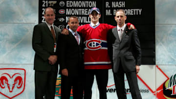 COLUMBUS, OH - JUNE 22: 22nd overall pick Max Pacioretty of the Montreal Canadiens poses with team personnel after being drafted in the first round of the 2007 NHL Entry Draft at Nationwide Arena on June 22, 2007 in Columbus, Ohio. (Photo by Bruce Bennett/Getty Images)
