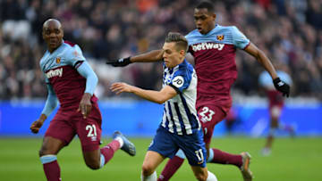 LONDON, ENGLAND - FEBRUARY 01: Leondro Trossard of Brighton and Hove Albion attempts to get away from Angelo Ogbonna and Issa Diop of West Ham United during the Premier League match between West Ham United and Brighton & Hove Albion at London Stadium on February 01, 2020 in London, United Kingdom. (Photo by Justin Setterfield/Getty Images)