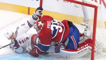 May 17, 2014; Montreal, Quebec, CAN; New York Rangers left wing Chris Kreider (20) crashes into Montreal Canadiens goalie Carey Price (31) during the second period in game one of the Eastern Conference Finals of the 2014 Stanley Cup Playoffs at Bell Centre. Mandatory Credit: Jean-Yves Ahern-USA TODAY Sports