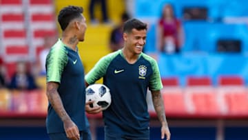 MOSCOW, RUSSIA - JUNE 26: (L-R) Roberto Firmino and Phillipe Coutinho smile during a Brazil training session and press conference ahead of the Group E match against Serbia at Spartak Stadium on June 26, 2018 in Moscow, Russia. (Photo by Buda Mendes/Getty Images)