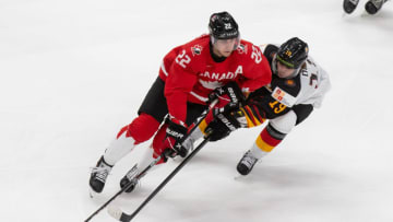 EDMONTON, AB - DECEMBER 26: Dylan Cozens #22 of Canada skates against Samuel Dube #19 of Germany during the 2021 IIHF World Junior Championship at Rogers Place on December 26, 2020 in Edmonton, Canada. (Photo by Codie McLachlan/Getty Images)