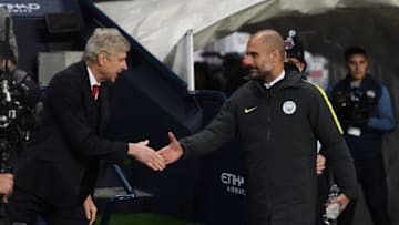 MANCHESTER, ENGLAND - DECEMBER 18: Arsene Wenger, Manager of Arsenal (L) and Josep Guardiola, Manager of Manchester City (R) shake hands prior to kick off during the Premier League match between Manchester City and Arsenal at the Etihad Stadium on December 18, 2016 in Manchester, England. (Photo by Michael Regan/Getty Images)
