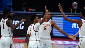 Mar 20, 2021; Indianapolis, Indiana, USA; Southern California Trojans guard Isaiah White (5) celebrates with forward Chevez Goodwin (1), guard Tahj Eaddy (2) and forward Evan Mobley (4) during the second half against the Drake Bulldogs in the first round of the 2021 NCAA Tournament at Bankers Life Fieldhouse. Mandatory Credit: Kirby Lee-USA TODAY Sports