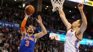 Nov 28, 2014; Oklahoma City, OK, USA; New York Knicks guard Jose Calderon (3) attempts a shot against Oklahoma City Thunder forward Nick Collison (4) during the second quarter at Chesapeake Energy Arena. Mandatory Credit: Mark D. Smith-USA TODAY Sports
