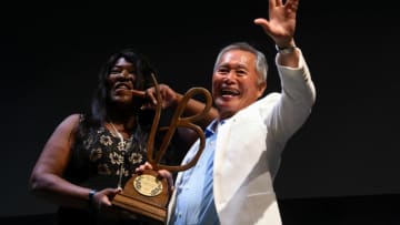 Best known for his role of Sulu on the original Star Trek television series, stage and film actor George Takei waves to the crowd with a 'live long and prosper' sign on Friday, June 8, 2018 after receiving the Life Worth Living Legend Award from festival founder and executive director Jerusha Stewart at the 2018 Vero Beach Wine + Film Festival at the Riverside Theatre in Vero Beach. Takei spoke of his early years as a young actor, working with prominent film actors and his advocacy for the LGBTQ community. "You got to have the strength, even after many rejections, to spring back and be able to approach that next interview with all the enthusiasm, the freshness and determination to do the best you can," Takei said when asked what advice he would give to aspiring actors. "Hang in there, be strong."Tcn 0608 Sa Vbwff Takei 01