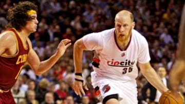 Nov 4, 2014; Portland, OR, USA; Portland Trail Blazers center Chris Kaman (35) drives past Cleveland Cavaliers center Anderson Varejao (17) during the second quarter at the Moda Center. Mandatory Credit: Craig Mitchelldyer-USA TODAY Sports