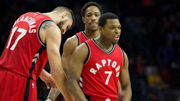Dec 14, 2016; Philadelphia, PA, USA; Toronto Raptors guard Kyle Lowry (7) reacts with center Jonas Valanciunas (17) after hitting a three pointer against the Philadelphia 76ers during the first quarter at Wells Fargo Center. Mandatory Credit: Bill Streicher-USA TODAY Sports