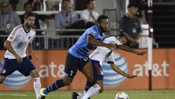 Jul 29, 2015; Denver, CO, USA; Tottenham Hotspur midfielder Mousa Dembele (19) and MLS All Star midfielder Juninho (9) of the LA Galaxy collide during the second half of the 2015 MLS All Star Game at Dick's Sporting Goods Park. Mandatory Credit: Kyle Terada-USA TODAY Sports